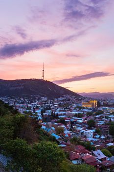 Sunset panorama view of Tbilisi, capital of Georgia country, from Narikala fortress.