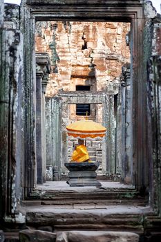 Sanctuary with Buddha statue and sacral decorations in Angkor Wat, a temple complex in Cambodia and the largest religious monument in the world. UNESCO World Heritage Site.