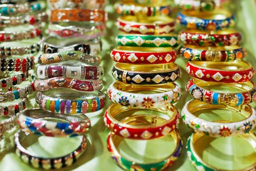 Colorful enameled bangles. Sale of souvenirs in the Siem Reap market, Cambodia.