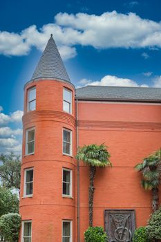 Red Brick Hotel with Round Tower in tropics