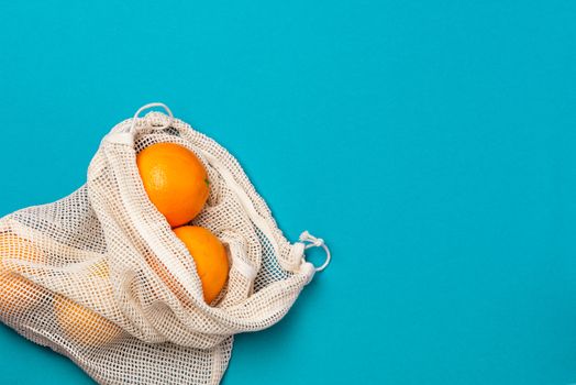 Ecological Reusable Shopping Bag with Fresh Orange Fruits on Vib