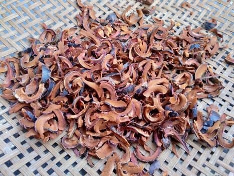 Dried mangosteen (Garcinia mangostana, purple mangosteen, manggis) peel. Mangosteen rind used as herbal medicine.