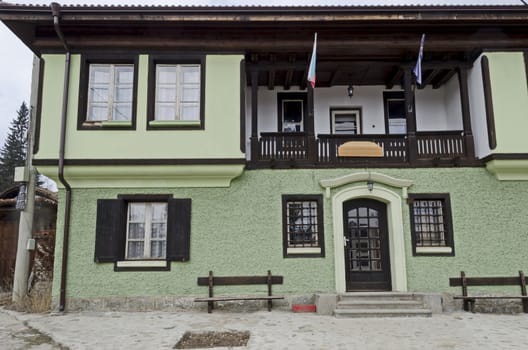 Authentic unique residential district with painted in bright colors houses, stone  walls, wooden windows, verandahs and picturesque eaves, Koprivshtitsa town