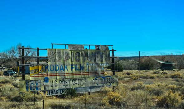 old advertising signs along a road on an Indian reservation in a suburb of Phoenix