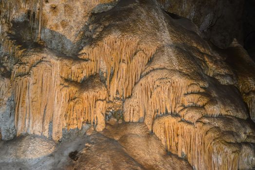 Calcite inlets, stalactites and stalagmites in large underground