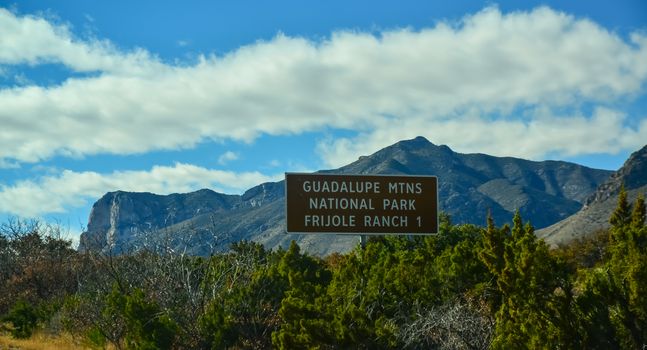 Information sign "Guadalupe National Park" on the background of mountains in New Mexico
