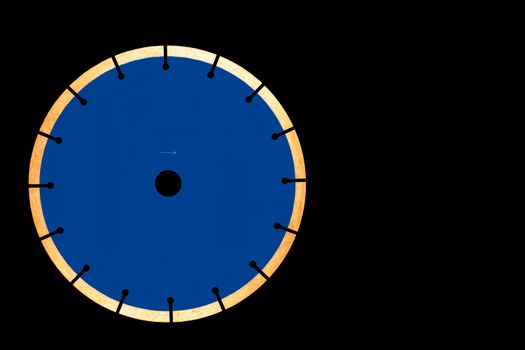 A cutting blade for cutting concrete in classic blue with diamond, 230 mm in diameter, isolated on a black background.