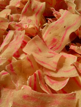 Raw cassava chips. Indonesia (Javanese) called it as opak telo. Traditional chips made off cassava. The taste is crunchy, savory, tasteful and delicious.