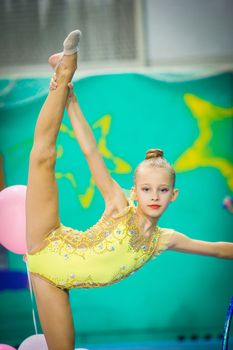 Little gymnast participates in competitions in rhythmic gymnastics
