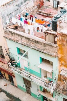 Authentic view of a street of Old Havana with old buildings and cars