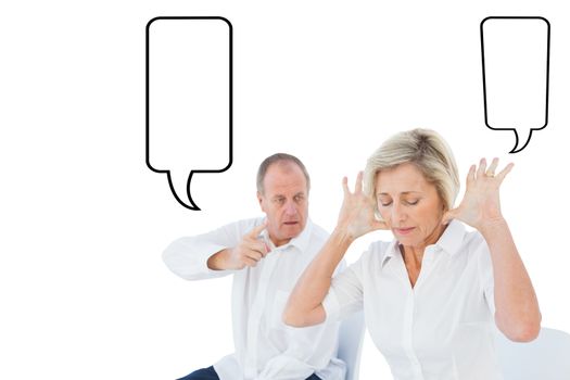 Composite image of older couple sitting in chairs arguing