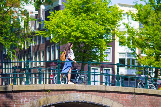 Young beautiful woman walking in european city, Amsterdam, Holland