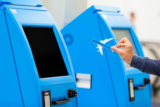 Closeup check-in for flight or buying airplane tickets at airport