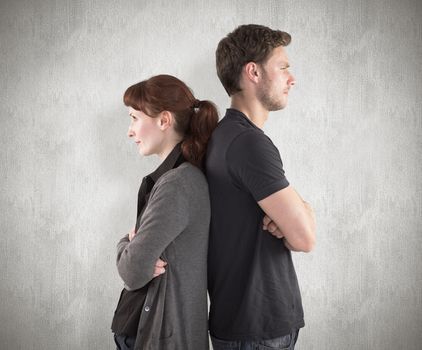 Composite image of irritated couple ignoring each other