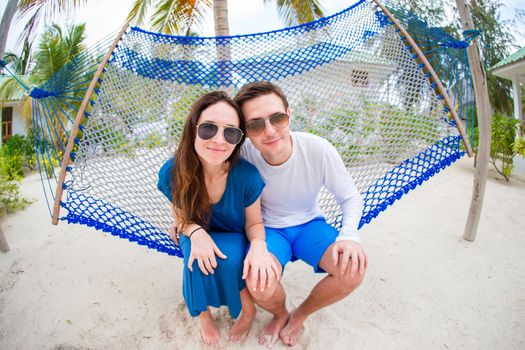 Happy Couple On The Beach In Honeymoon
