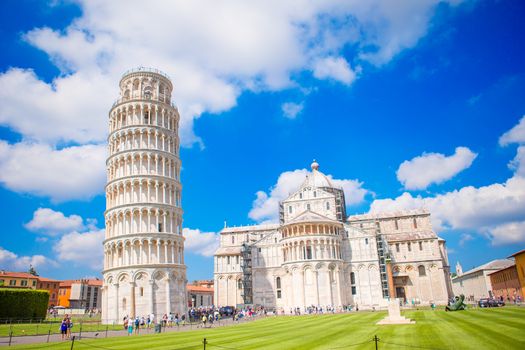 Tourists visiting the leaning tower of Pisa , Italy