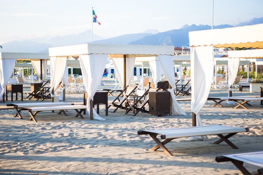 Sunbeds and loungers on european sand beach