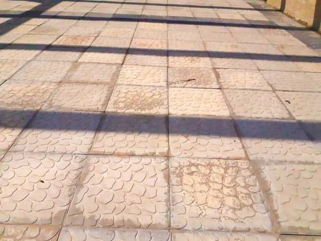 abstract view of tiles on the road floor