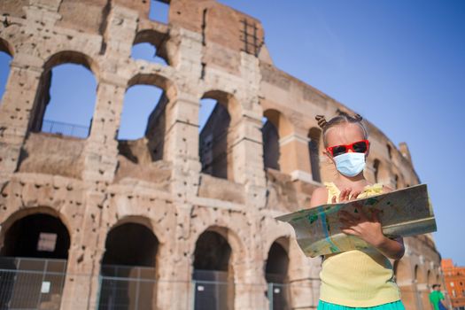 Little girl in front of colosseum in Rome, Italy