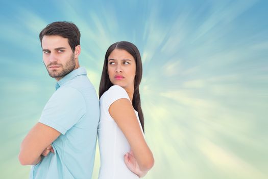 Composite image of unhappy couple not speaking to each other 