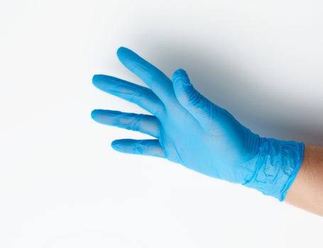 blue medical glove is worn on the arm, part of the body on a whi