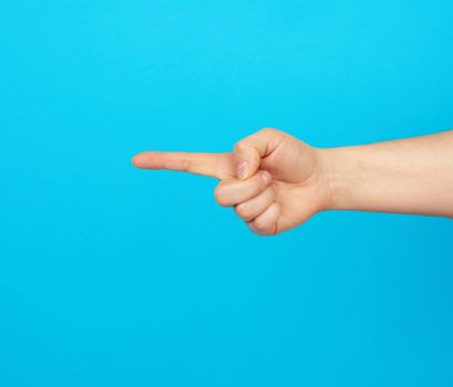 hand shows forefinger gesture on a blue background