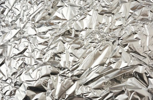 texture of matte crumpled piece of foil, food and objects packag