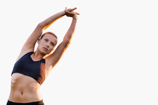 Cutout of young active attractive woman stretching her arms