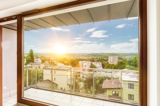 Photo of window view inside apartment with lens flare in backgro