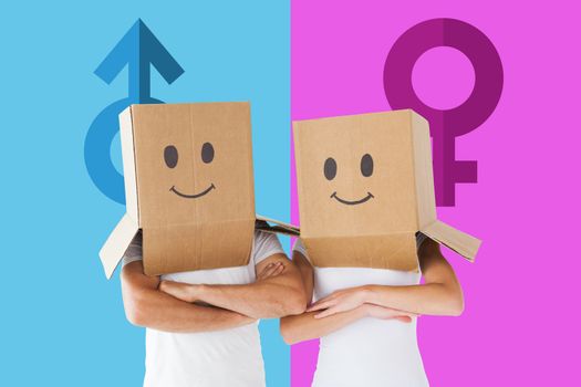 Composite image of couple wearing smiley face boxes on their heads