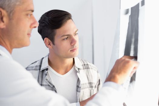 Doctor showing X rays to his patient 