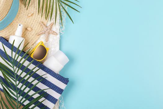 Beach accessories on the blue background