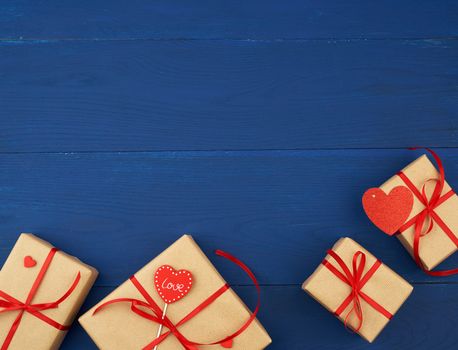brown box with a gift and a red paper heart