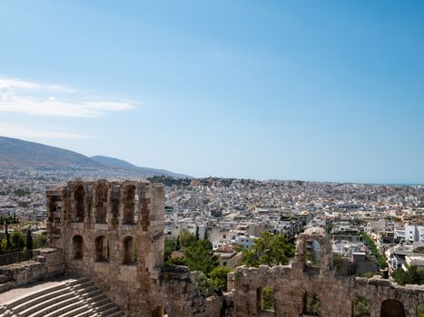 Odeon of Herodes Atticus at the Acropolis with Athens city in Gr