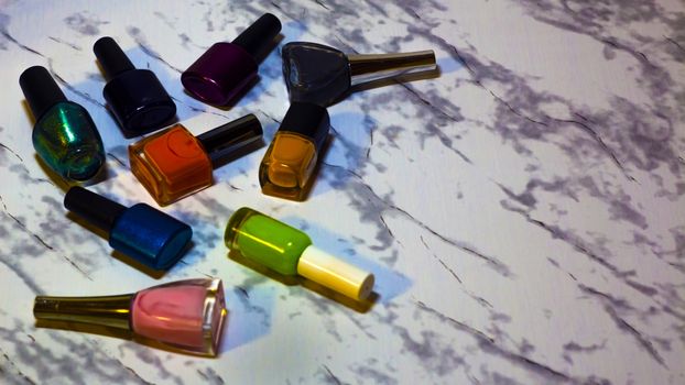 Scattered nail Polish in the beauty salon. The choice of color n