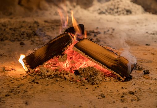 Wood firewood ablaze in rural cabin