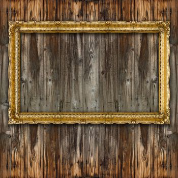 Retro Big Old Gold Picture Frame on wood wall