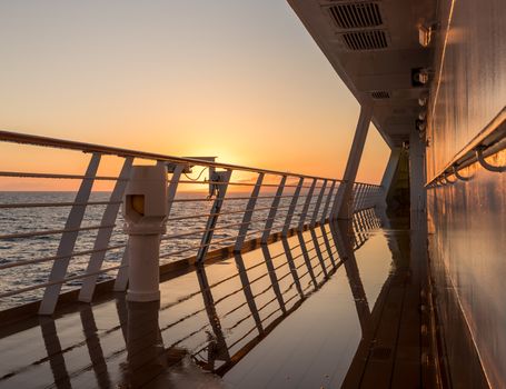 Cruise ship sailing the seas at sunrise or dawn