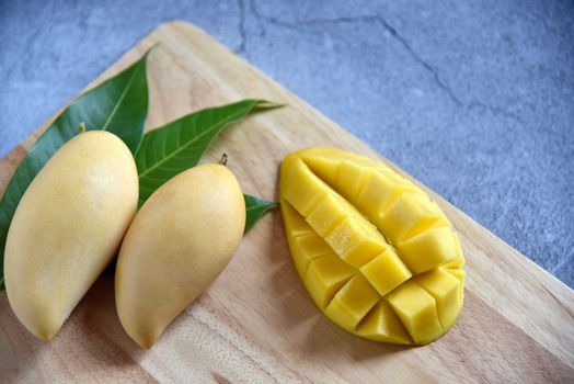 Tropical Fruits. Fresh and beautiful mango fruit set in a wooden