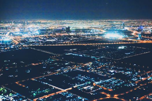 Aerial night view of Dubai in United Arab Emirates, metropolitan cityscape