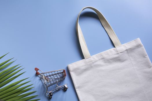White tote bag canvas fabric and chopping cart. Cloth shopping s