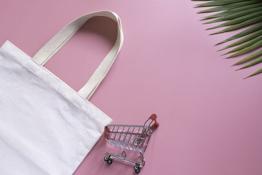 White tote bag canvas fabric and chopping cart. Cloth shopping s