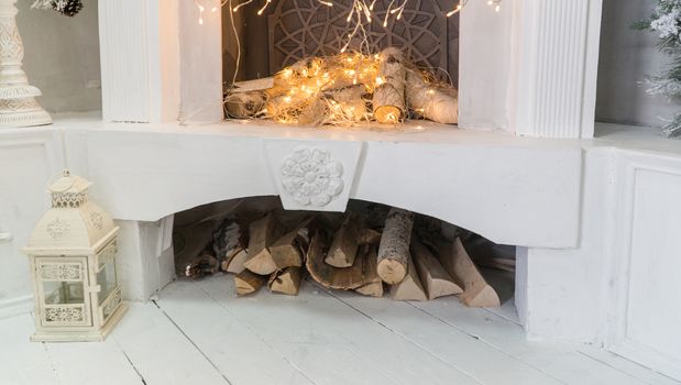 Christmas fireplace with glowing garlands