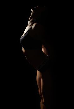 silhouette of a beautiful young girl of athletic appearance