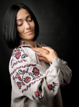beautiful young woman in an embroidered ancient Ukrainian dress 