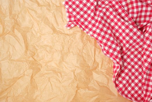 white red checkered kitchen towel on a brown paper background