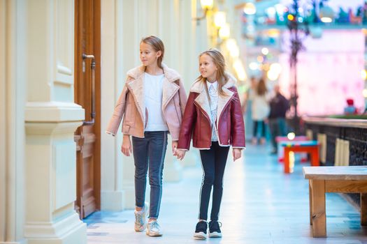 Adorable little girls on shopping in mall