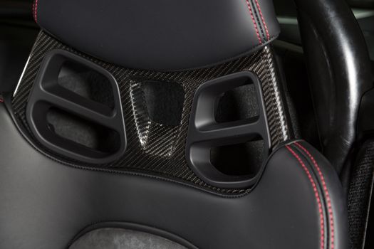 Close up of carbon fibre car seat headrest