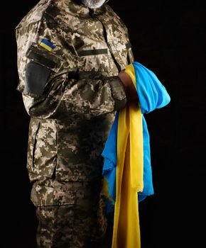 a male soldier dressed in a military uniform of the Ukrainian ar