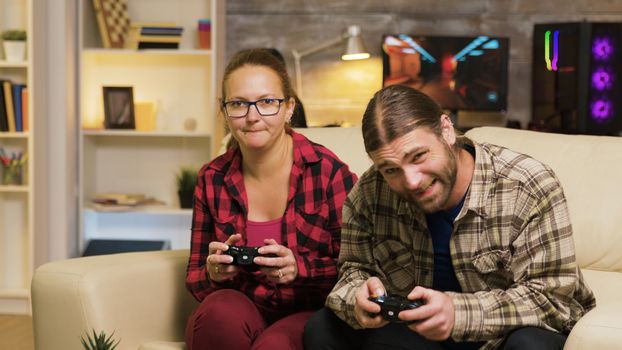 Woman yelling at her boyfriend after losing at video games